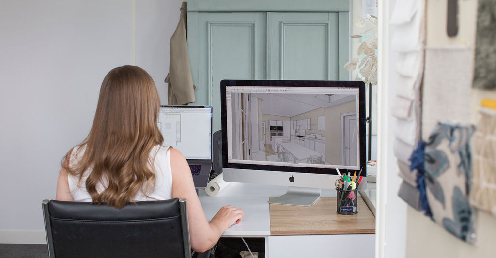 Interior designer creating CAD kitchen layout during renovation planning