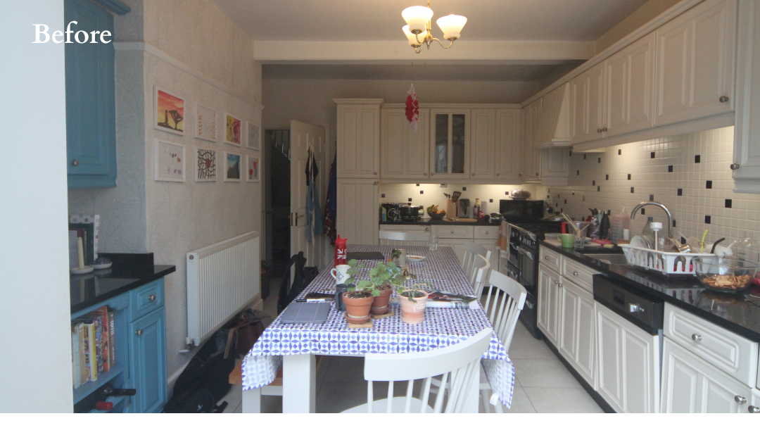 Before - original kitchen-diner with cream traditional cabinetry, dark tile splashback and white dining table, prior to redesign including bespoke concealed bar by The House Ministry.