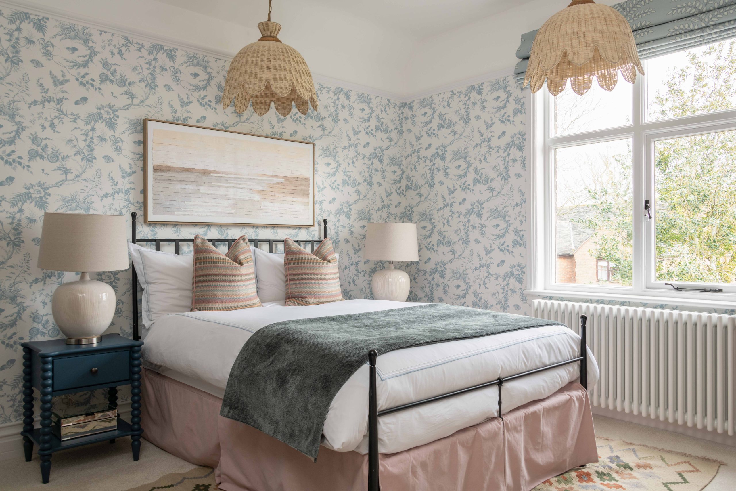 After - Finished Daughter’s Bedroom with Floral Wallpaper | The House Ministry After - Completed daughter’s bedroom with blue floral wallpaper, bobbin style bedside tables and statement pendant lights, designed by The House Ministry
