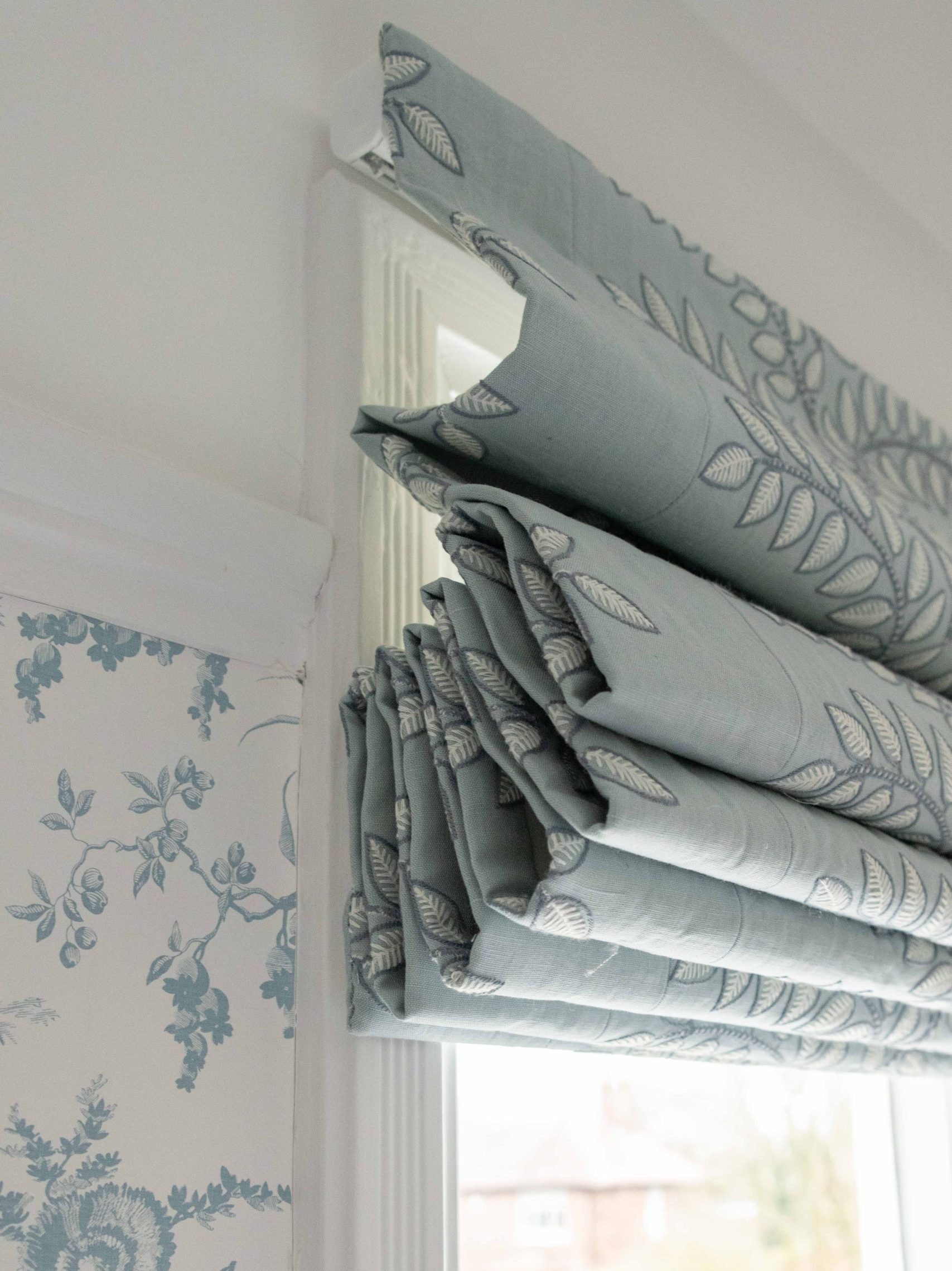 Roman Blind Detail in Daughter’s Bedroom | The House Ministry Blue patterned Roman blind detail in daughter’s bedroom, designed by The House Ministry