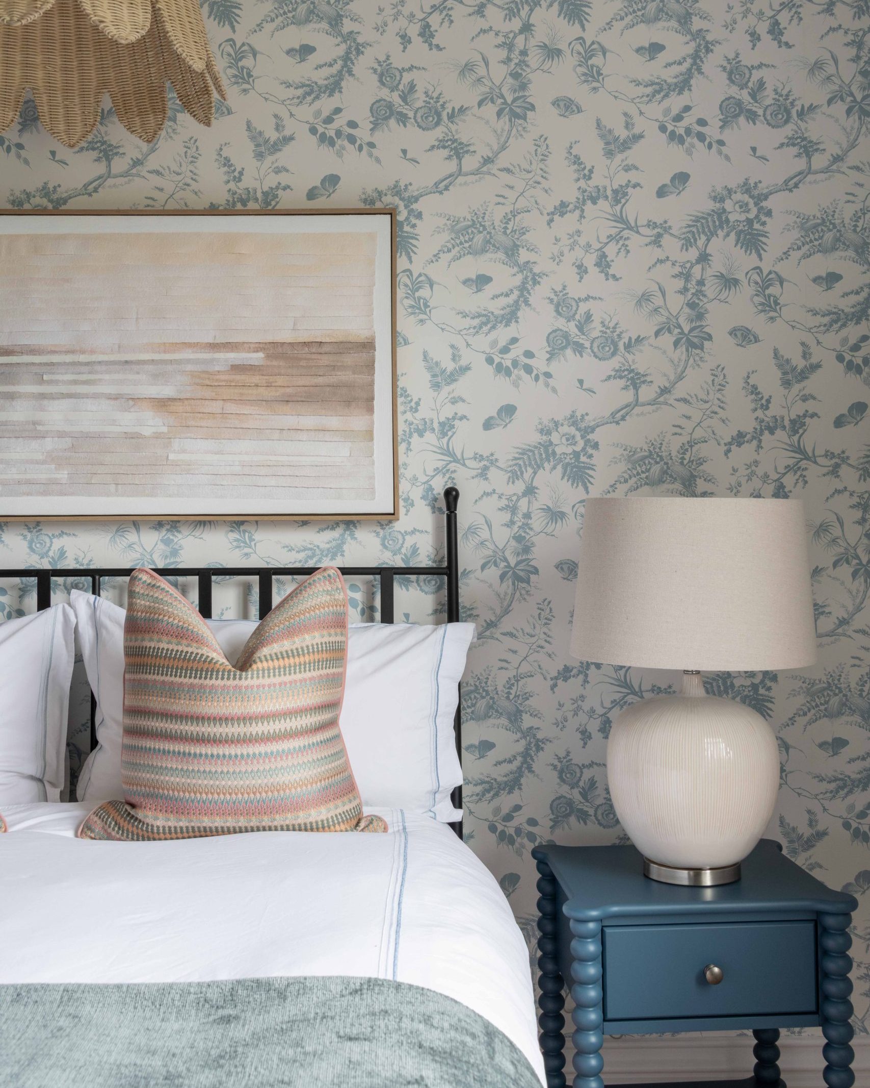 Bedroom Styling Detail with Floral Wallpaper | The House Ministry Bedroom styling detail with floral wallpaper, blue bobbin bedside table and layered bedding, designed by The House Ministry