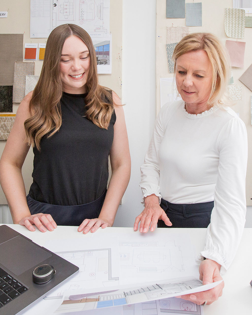 Interior design consultation at The House Ministry studio in Cheltenham, reviewing plans and samples for a home project