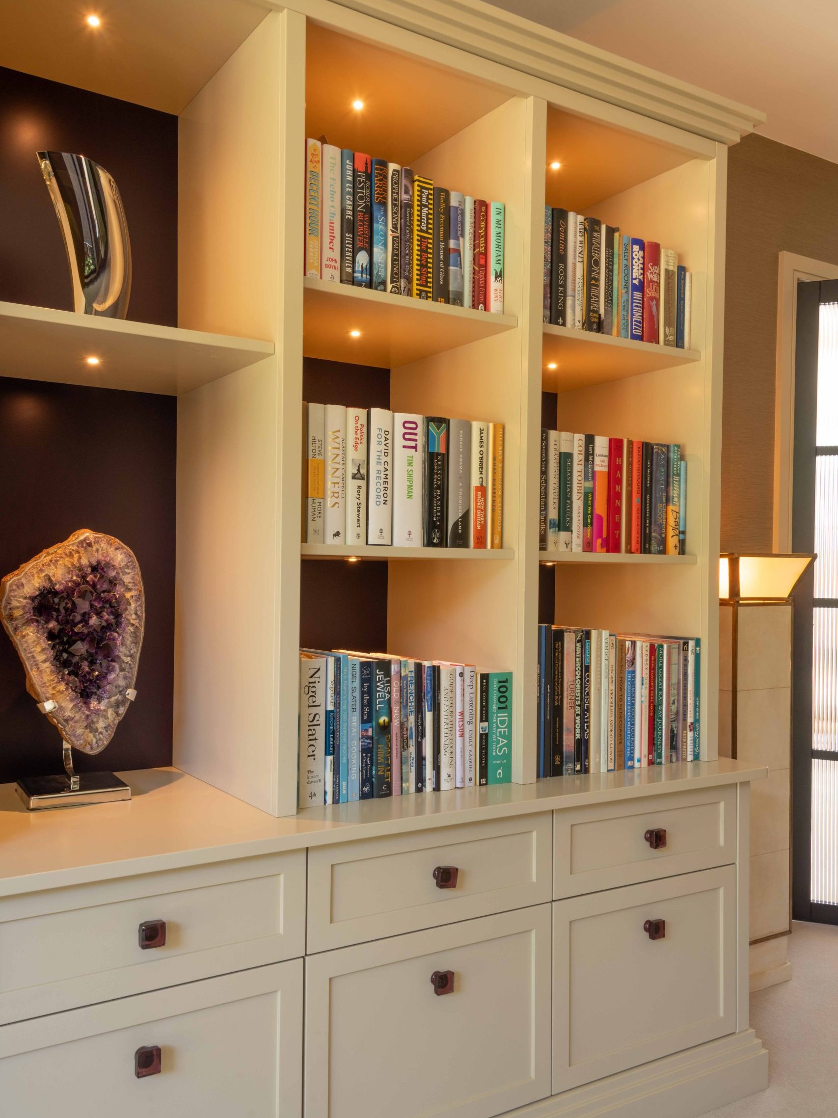 Bespoke Bookcase Detail | The House Ministry Bespoke painted bookcase design with open shelving, lit display niche and drawer storage